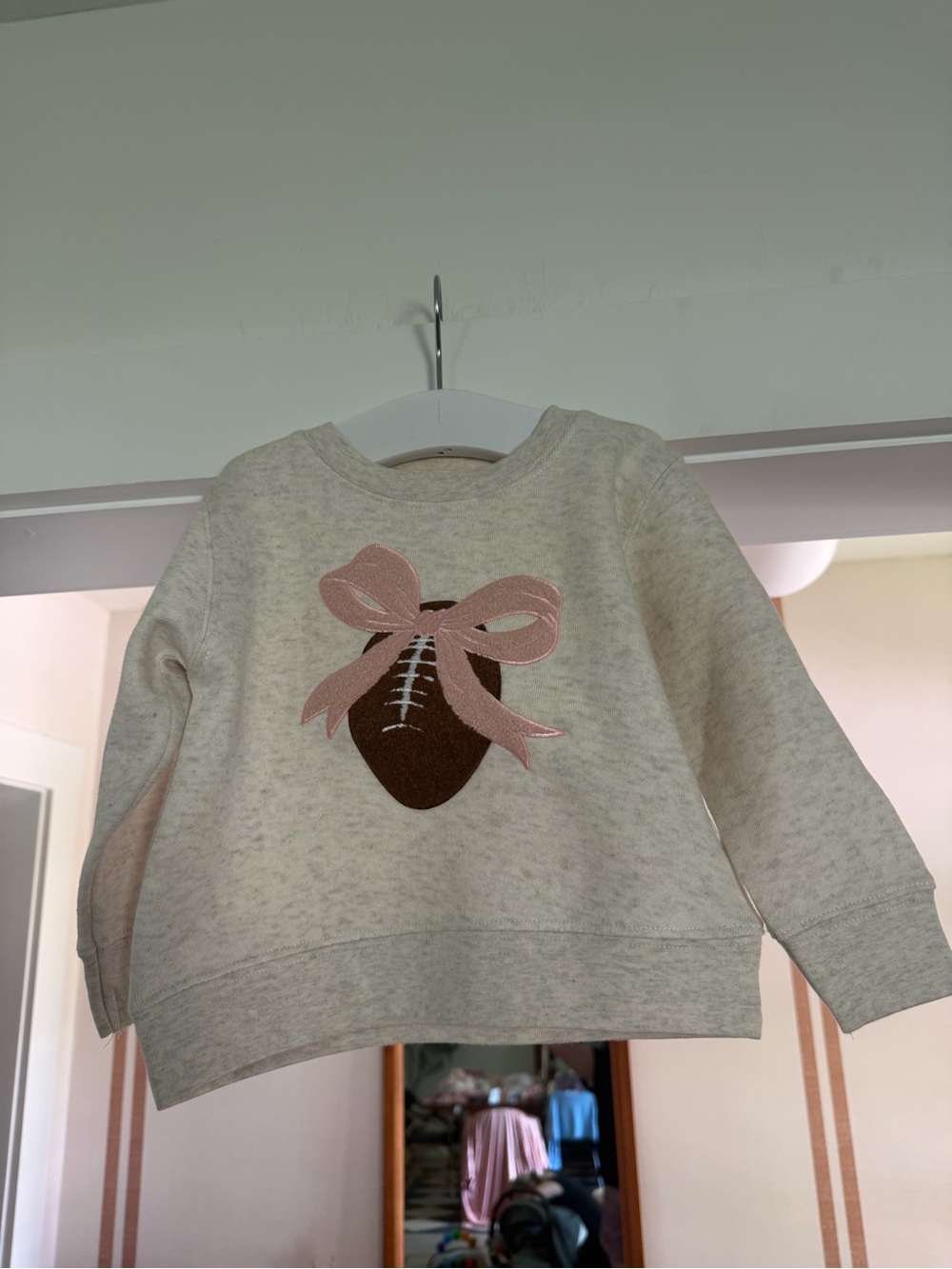 Wink Cream Sweatshirt with Brown Football and Pink Bow